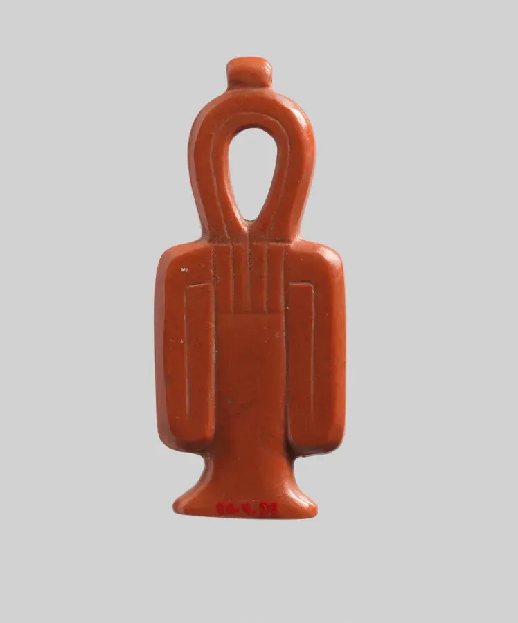 Amuleto tit egipcio antiguo en jaspe, forma del Nudo de Isis, Reino Nuevo