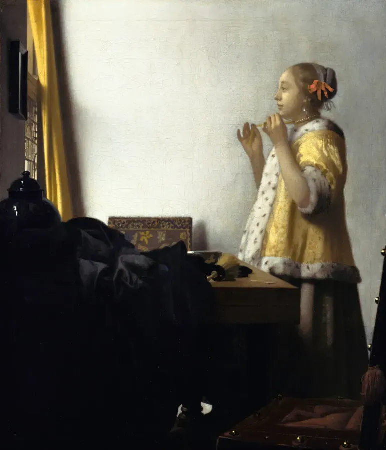 Young woman wearing a single pearl earring, by Johannes Vermeer