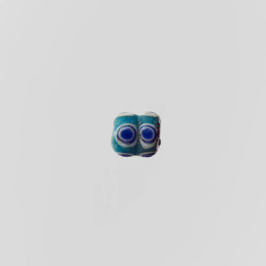 Cuenta fenicia de vidrio con forma de ojo, siglos VI–IV a. C.