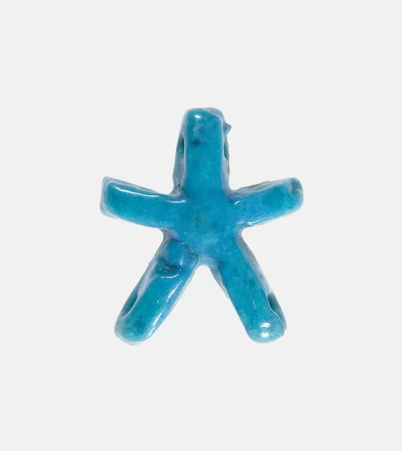 Estrella colgante de fayenza del antiguo Egipto, ejemplo temprano de la estrella como joya amuleto
